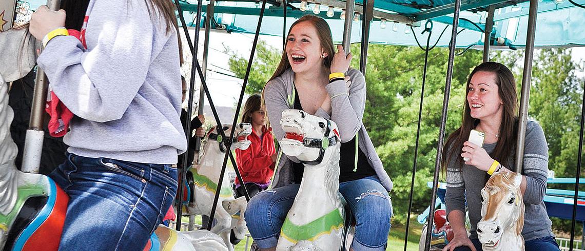 Students on a carousel